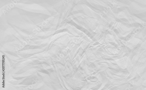 Crumpled paper texture with a monochromatic gray and white color scheme
