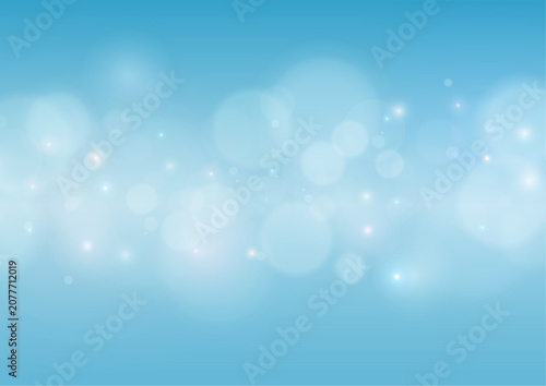 Foto Abstract soft white glowing bokeh lights on bright light blue background with ba