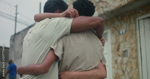фотографія Close-up of a family of African descent in a heartfelt group hug, highlighting u