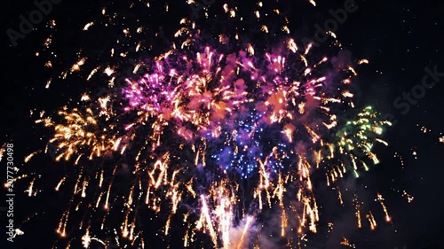 Vibrant multi-colored fireworks display exploding in night sky for celebration and festive events pyrotechnics