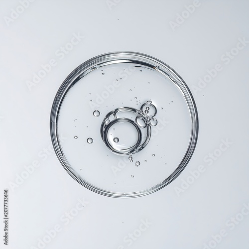 Close-up view of water droplets on a circular surface.
