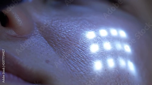 Close-up of face with LED light.