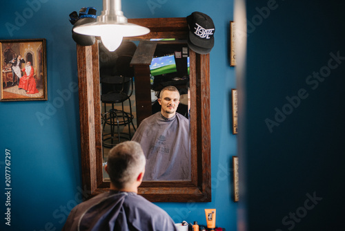 portrait of a young guy groom at the training camp in the barbershop