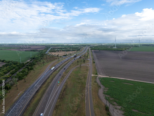 Obraz na plátně Aerial view showing busy highway traffic on us 77 n intersecting agricultural fi