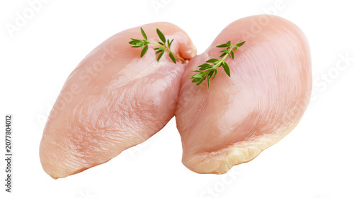 Foto Two raw chicken breasts with thyme sprigs