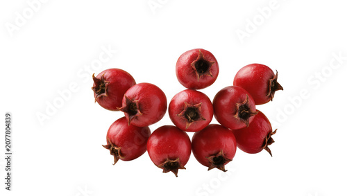 Photos Heap of ripe red hawthorn berries with star-shaped calyx remnants