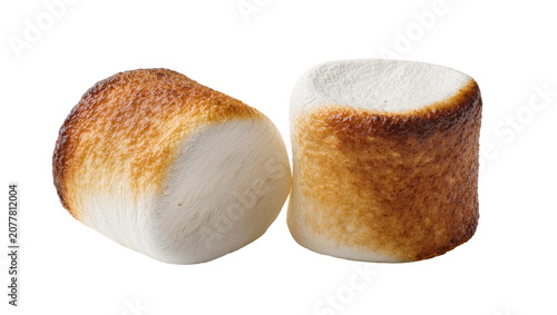 Two toasted marshmallows with golden brown caramelized crust, isolated on transparent background