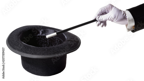 Konstfotografi Magician s hand in white glove holding wand over top hat, isolated on transparen