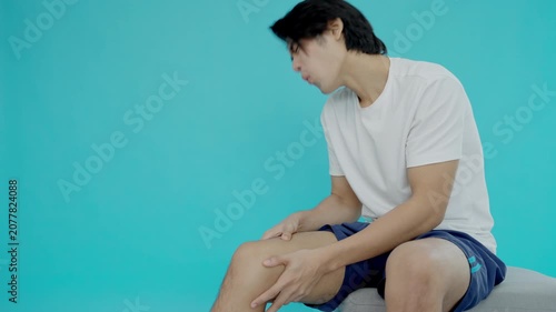 male athlete or spot male having knee injury due to ligament inflammation, man knee pain due to exercise, massage, muscle relaxation, rheumatoid arthritis, gait disturbance, rheumatoid arthritis