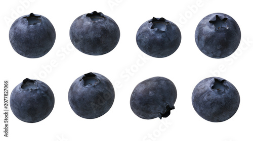 Fotografie Eight fresh blueberries with dark blue skin and visible calyx