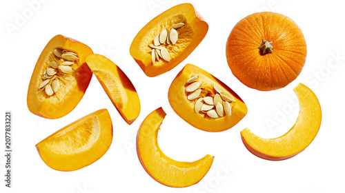 фотографія Orange pumpkin pieces and whole pumpkin scattered