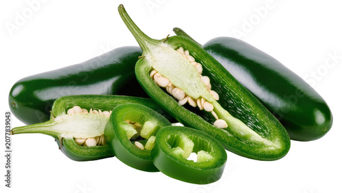 Whole and sliced green jalapeno peppers with seeds