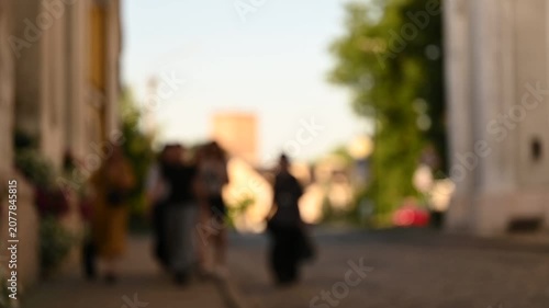 city ​​street with passersby defocused background
