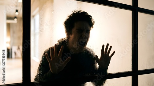 Man Trapped Behind Glass Screaming In Fear And Despair