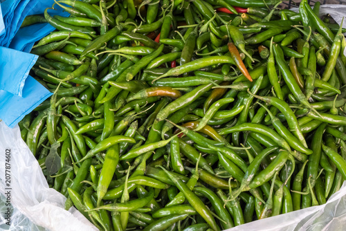 Obraz na plátně Green chilies in a grocery store in Athens, Greece