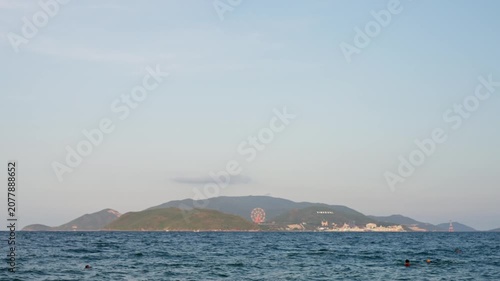 Nha Trang Vietnam. 01 06 2026 Calm coastal seascape midshot showing distant island on horizon under pale sky
