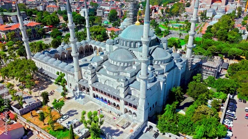 Drone view of the Blue Mosque in Istanbul, Turkey. Sultanahmet Camii is surrounded by green gardens, historic streets and the dense cityscape of old Istanbul.