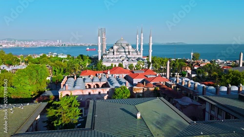 Drone view of the Blue Mosque area in Istanbul, Turkey. Sultanahmet Camii, historic rooftops, gardens and the Bosphorus shape the famous city landscape.