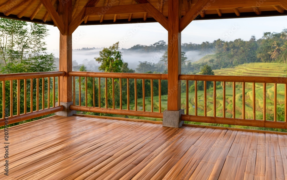 Fototapeta premium Tranquil Open-Air Platform Overlooking Lush Indonesian Rice Terraces at Dawn