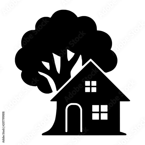 Foto House Built Around Tree Silhouette