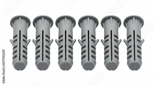 Set of six plastic wall anchors isolated on white background