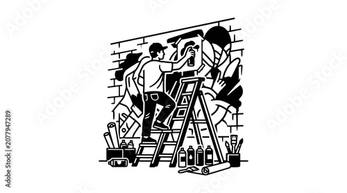 Artist painting mural on brick wall with spray paint from ladder.