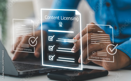 Fotografie Businessman signing virtual content licensing agreement and digital rights manag