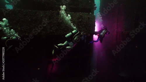 Scuba Divers Swim Through Dark Eerie Section of USS Oriskany Shipwreck Underwater