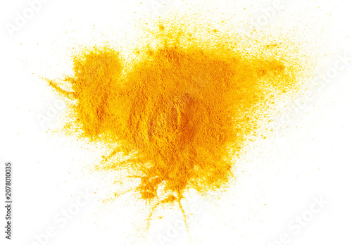 Turmeric powder pile isolated on white background, top view, clipping path