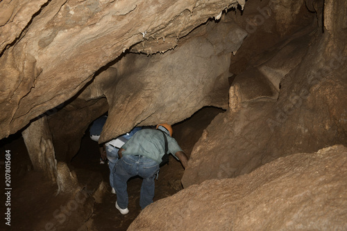 narrow navigable limestone rock passages to pass inside khao wang thong cave, thailand