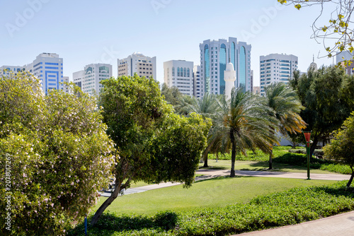 Modern cityscape with greenery, view from Family park in Abu Dhabi, UAE