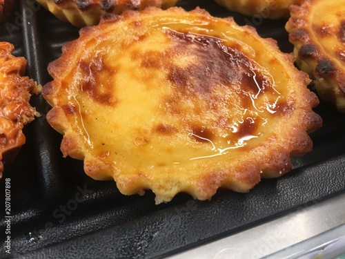 Traditional Portuguese custard tart with golden flaky crust
