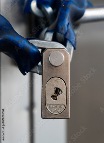 Tableau sur toile Close-up shot of a heavy-duty metal padlock with Made in Italy text engraved on