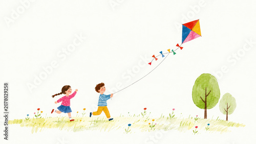 Children flying a colorful kite in a park with large copy space.