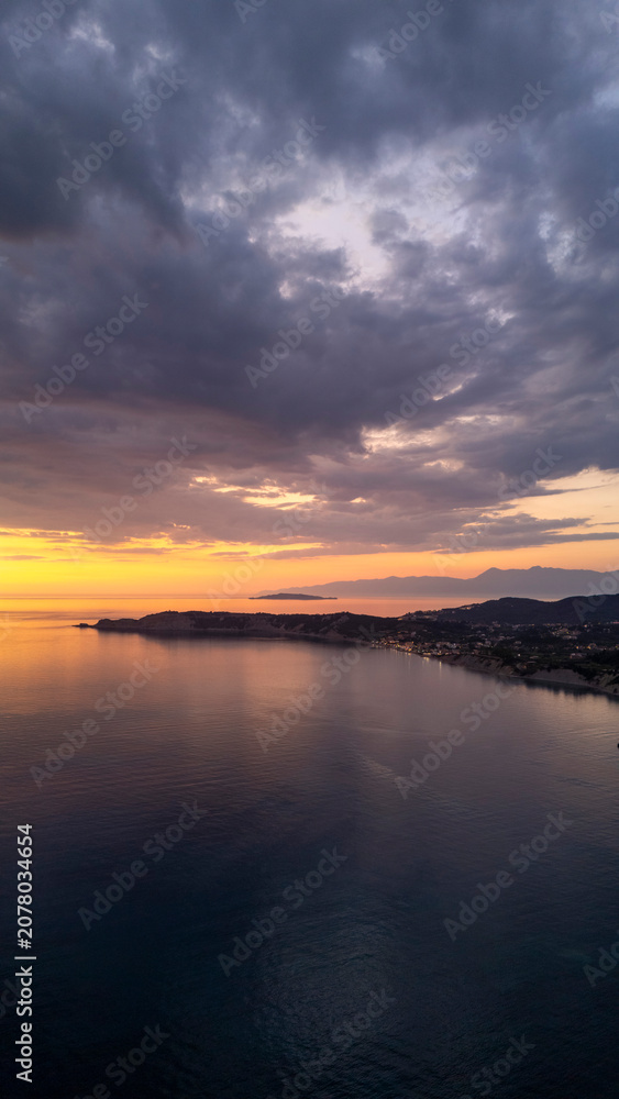 Fototapeta premium Sunset over coastline and islands in Corfu, Greece