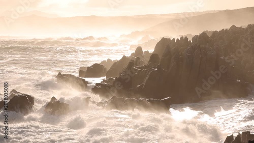magnificent rocky coastline and waves, DeKelders, South Africa early morning