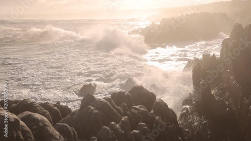 magnificent rocky coastline and waves, DeKelders, South Africa early morning