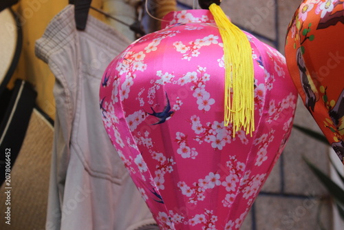 Pink fabric lantern with swallows and white cherry blossom pattern for holidays.
