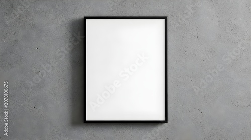 Minimalist black frame with blank white space on a textured concrete wall