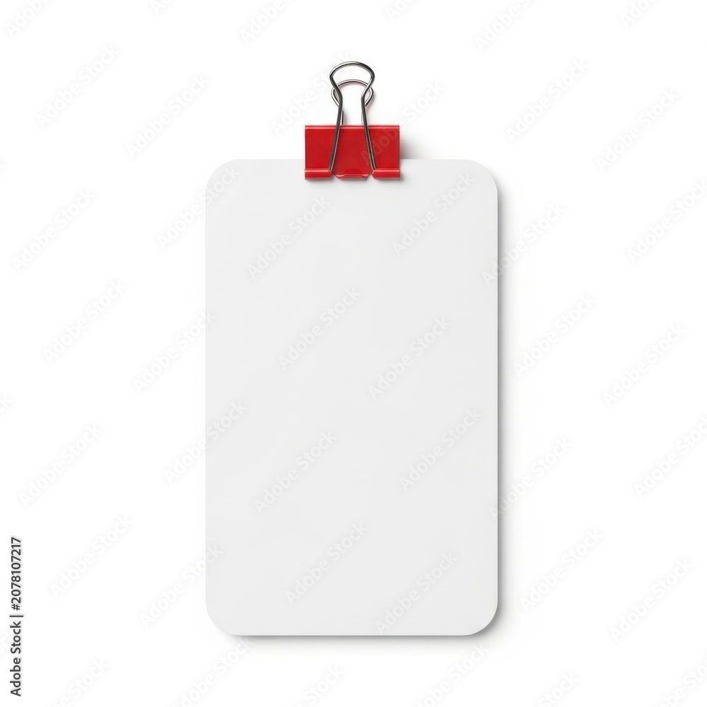 Fototapeta premium Blank white notepad secured with a red binder clip on a plain background