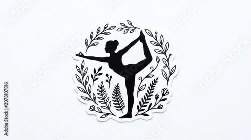 Black silhouette of a woman in yoga pose surrounded by floral elements