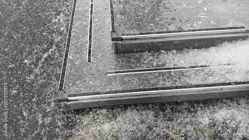 Poplar fluff accumulation on outdoor steps, showing gradual buildup and surrounding details