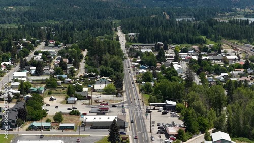 Aerial of small town Priest River Idaho in Bonner County with main street running through the commercial core and neighborhoods in summer