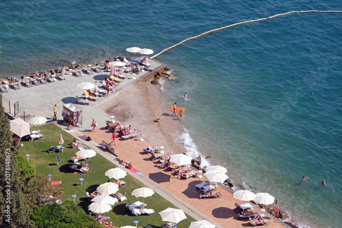 фотографія Tourists enjoy the beach in Portoroz, Slovenia