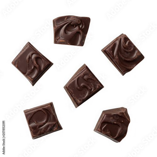 A group of chocolate fudge pieces on a white background