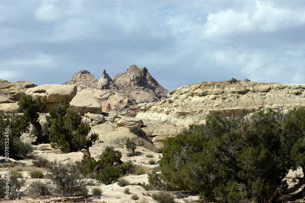 Fototapeta premium Intriguing landscape and dramatic sky along Temple Mountain Road, near Goblin Valley State Park in Utah