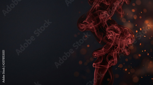 Abstract red smoke swirl with glowing ember particles on a dark background