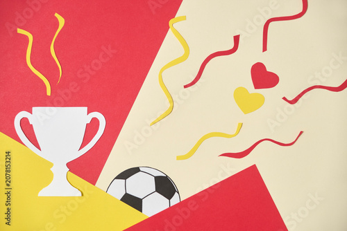 Paper hearts in red and yellow, the colors of the Spanish flag, and a trophy symbolizing victory and national pride