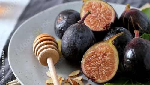 Fresh Figs with Honey and Almonds on a Plate