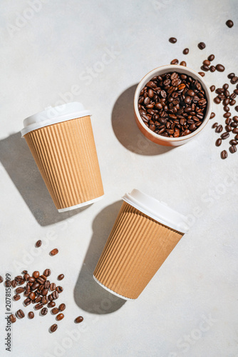 Roasted Coffee Beans and Takeaway Coffee Cups with on Light Background